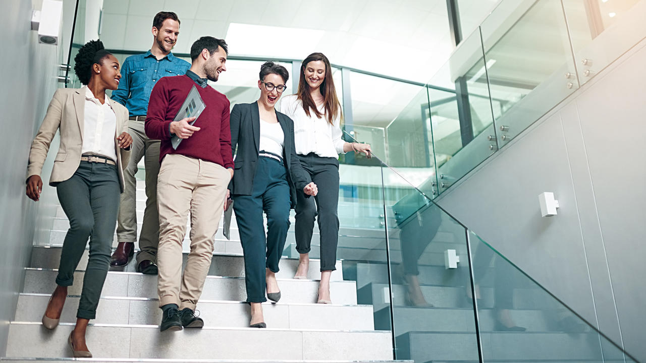 Young professionals walking down a staircase
